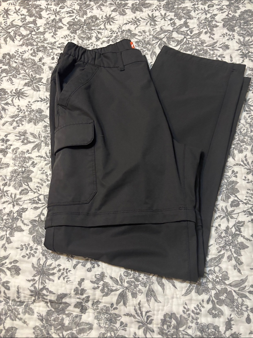 Women’s  Black Cargo Pants with Utility Pocket and zip off pant legs.